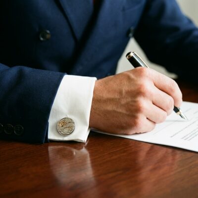 Mechanical Watch Cufflinks- Signature No. 2 worn on the cuff – navy double breasted suit signing contract