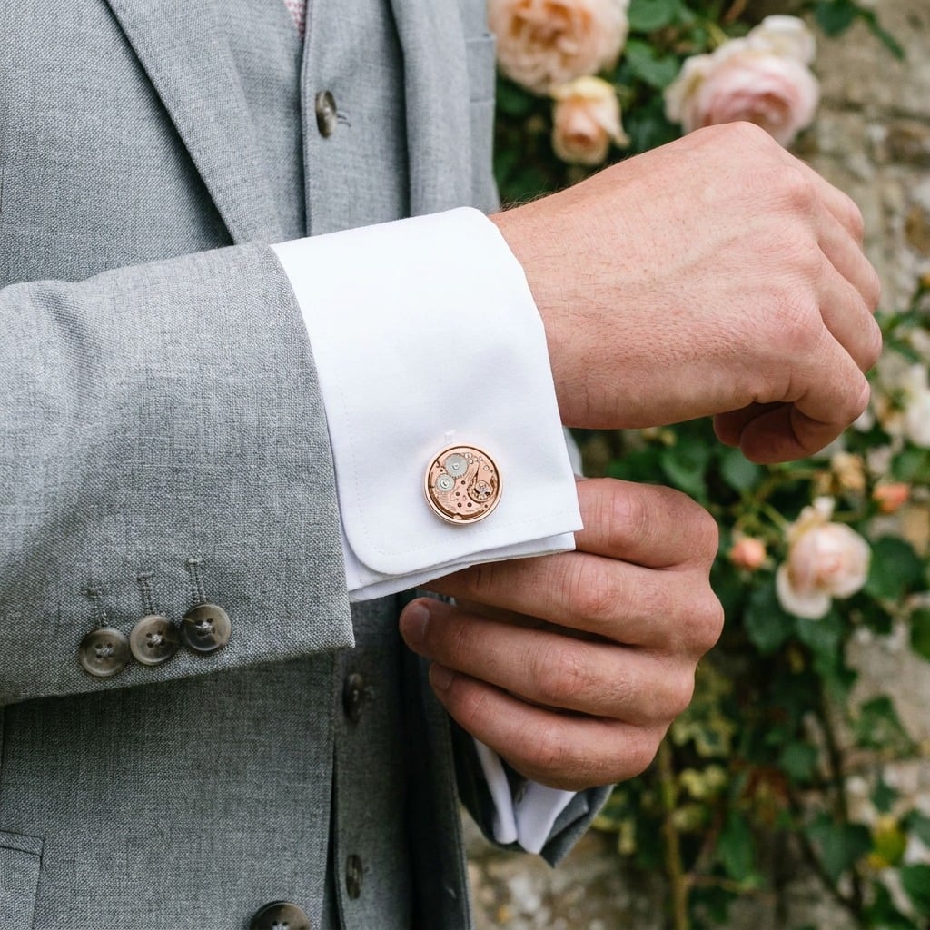 Omega Watch Cufflinks - 625 Calibre - Rose Gold worn on the cuff – light grey suit country house wedding